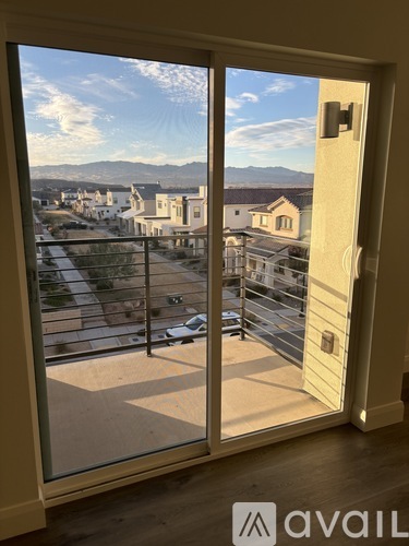 A view from a window looking out at a residential area.