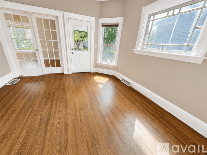 A room with wooden floors and white walls.
