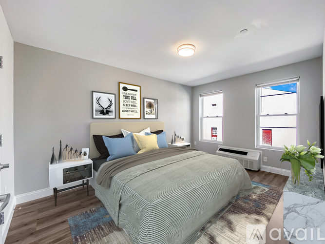A bedroom with a large bed and a window.