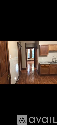 A kitchen with wooden cabinets and a sink.