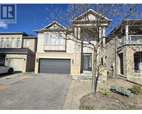 A house with a garage is for sale.