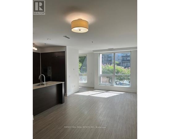 A modern kitchen with a sink and a window.