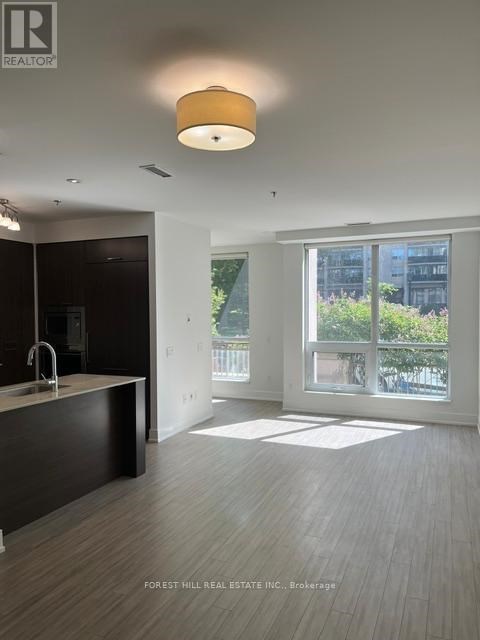 A modern kitchen with a sink and a window.