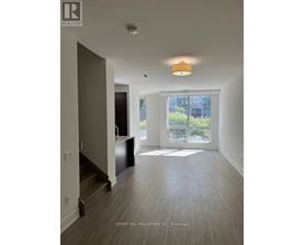 A spacious living room with a view of the city.