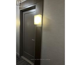 A door with a light on it in a room.