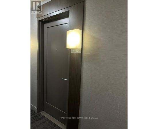 A door with a light on it in a room.