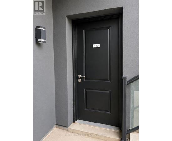 A black door with a number 120 on it.