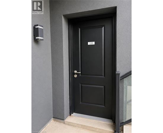 A black door with a number 120 on it.