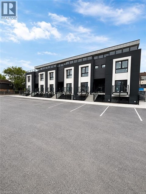 A building with a parking lot in front of it.