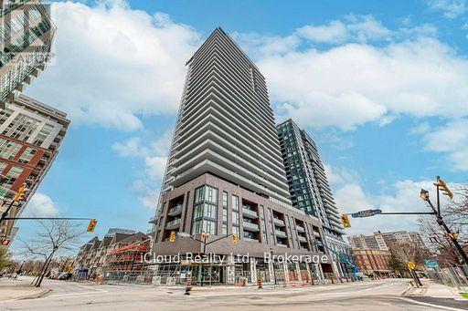 A modern building with a triangular top is the focal point of the image.