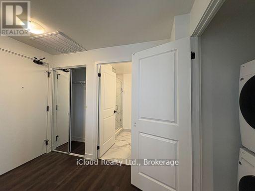 A white door is open to a hallway.