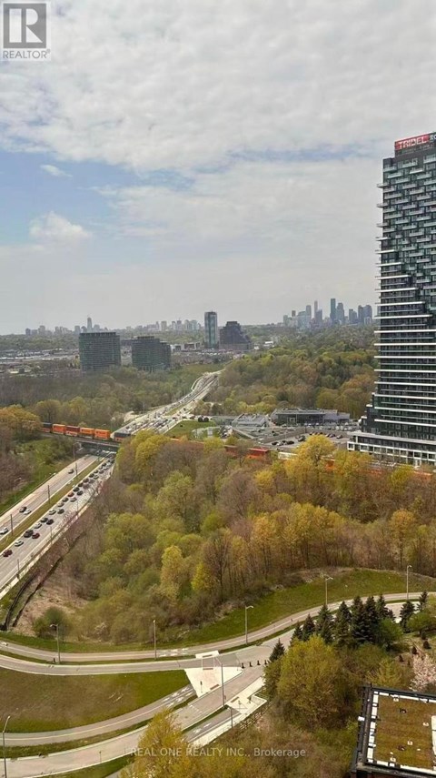 A real estate company logo is visible on a building in the distance.