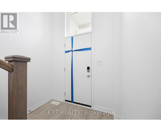 A white door with blue tape on it in a room.