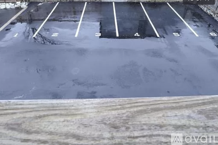 A parking lot with numbered parking spaces.