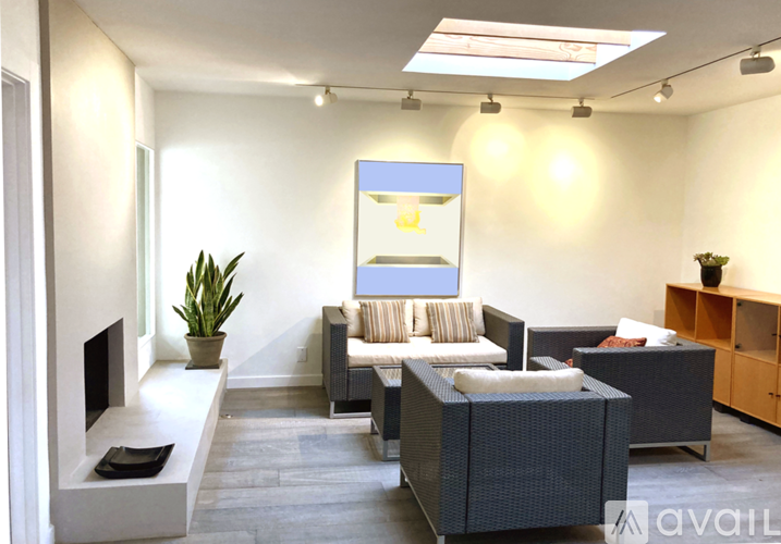 A living room with a grey sofa and a television.