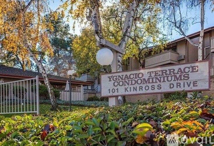A sign for Ygnacio Terrace Condominiums is in front of a building.