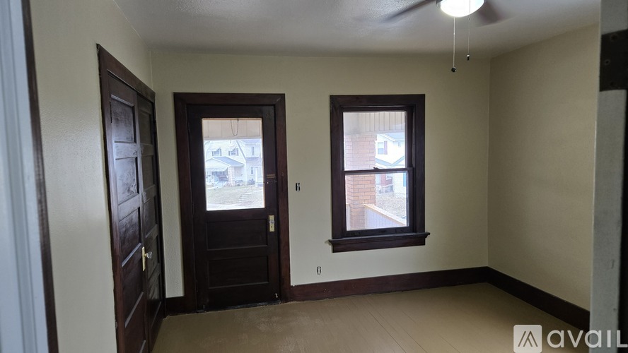 A room with a door and a window.