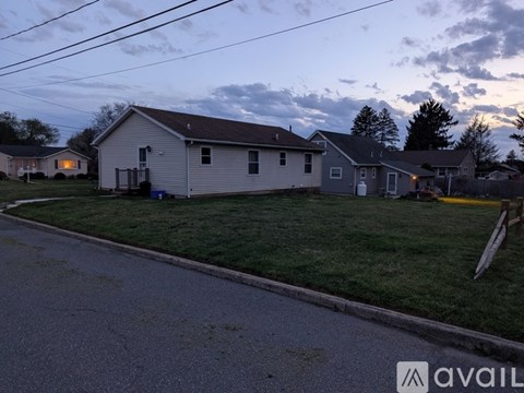 A house with a yard is shown in the image.