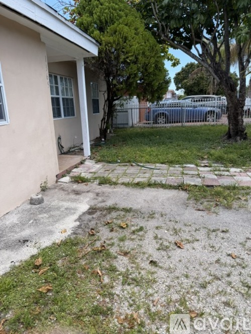 A small house with a white door and a small porch.