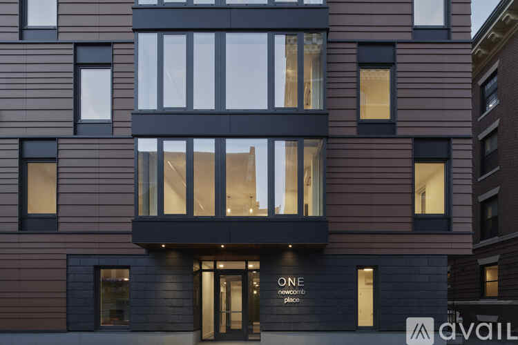 A modern building with the word "ONE" prominently displayed on the front.