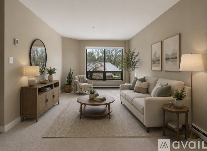 A well-lit living room with a large window and a view of a house across the way.