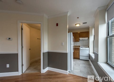 A kitchen area with a stove and a refrigerator.