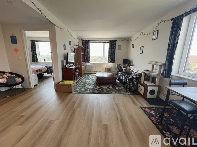 A living room with wooden floors and furniture.