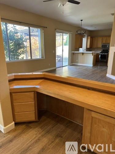 A kitchen with a counter and a window.