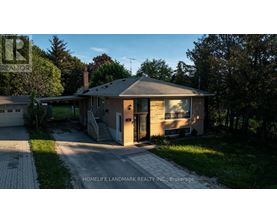 A house with a driveway in front of it.