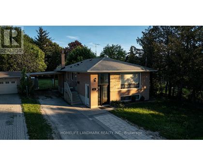 A house with a driveway in front of it.