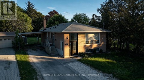 A house with a driveway in front of it.