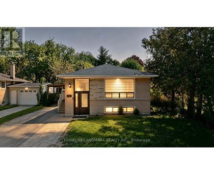 A house with a front yard and a driveway is shown.