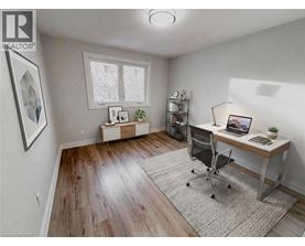 A room with a desk and a chair.