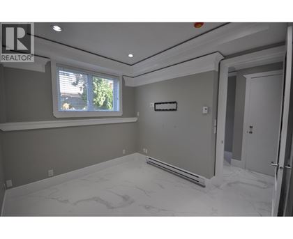 A room with a window and a door is shown.