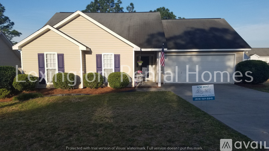 A house with a sign that says "National Homes" in front of it.