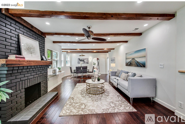 A living room with a fireplace and a couch.