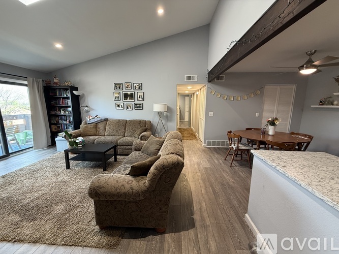 A living room with a couch, chair, and a coffee table.