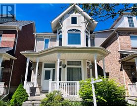 A house with a white porch and a brick facade.