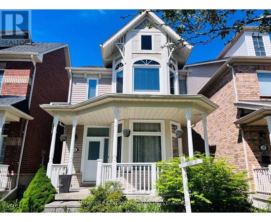 A house with a white porch and a brick facade.