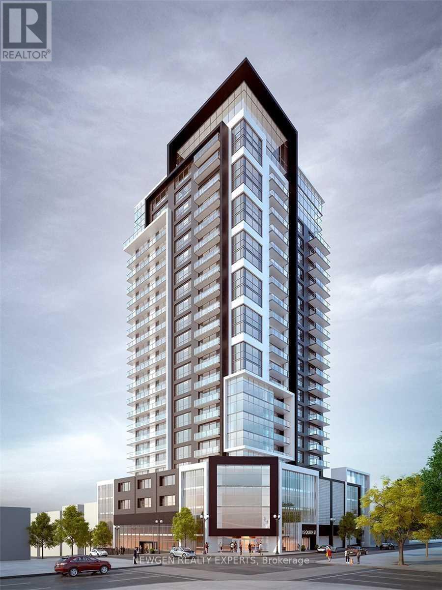 A tall building with a glass facade is the main focus of the image.