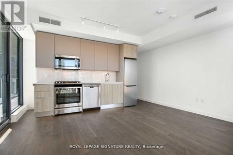 A kitchen with a stove top oven and a microwave above it.