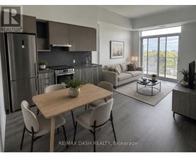A modern kitchen with a dining table and chairs.