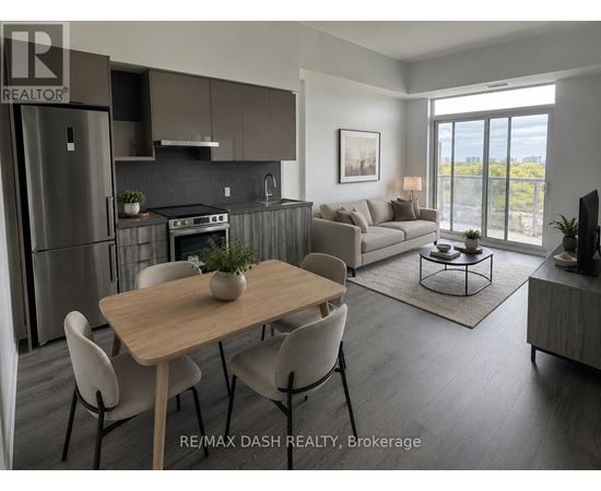 A modern kitchen with a dining table and chairs.