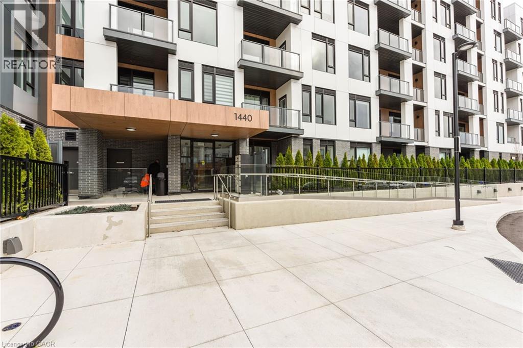 A modern apartment building with the number 1440 on the front.