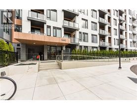 A modern apartment building with the number 1440 on the front.