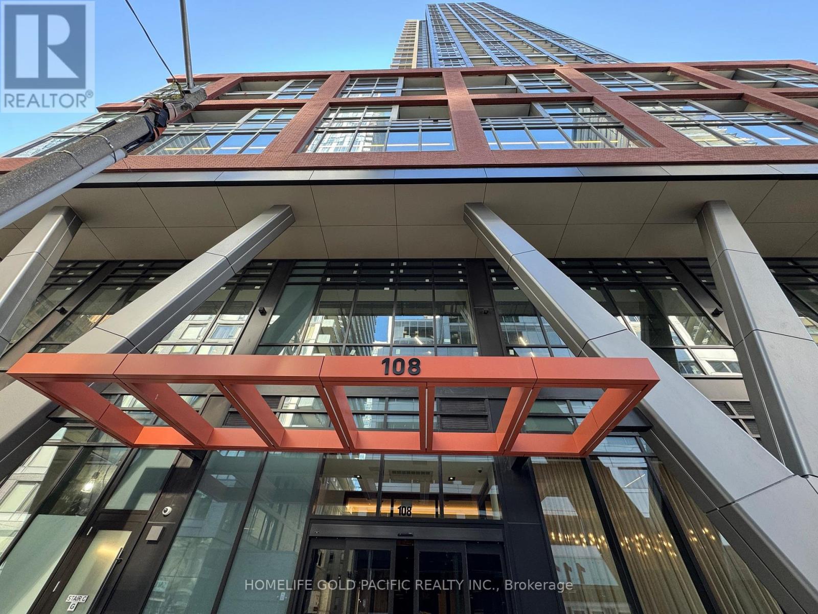 A tall building with the number 108 on it.