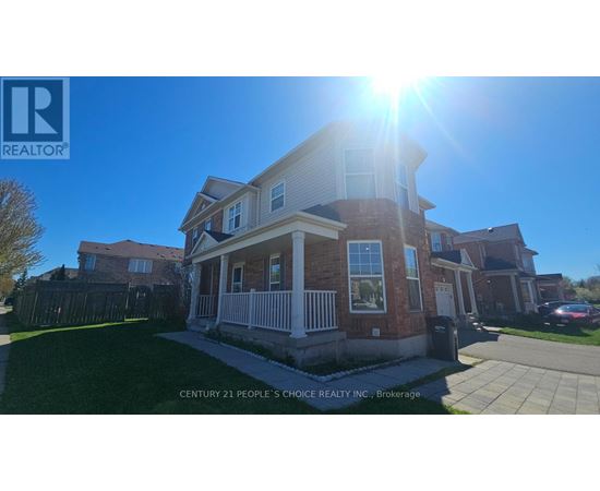 A house with a sunny sky in the background.