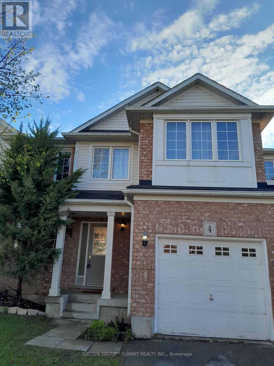 A house with a white garage door and a brick facade.