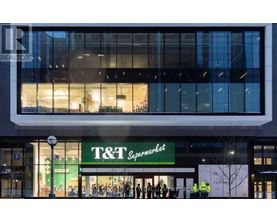 A T&T Supermarket is seen from the street with a REALTOR sign above it.
