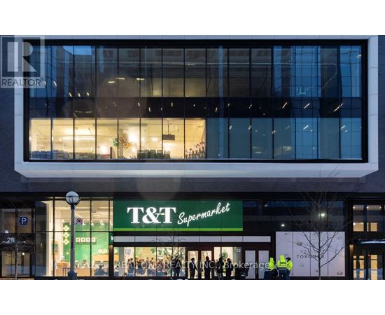A T&T Supermarket is seen from the street with a REALTOR sign above it.